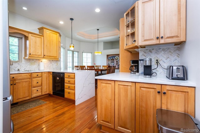 10267 Coachman Ct, Davison, MI 48423 - kitchen featuring a peninsula, wood finished floors, tasteful backsplash, light countertops, and recessed lighting