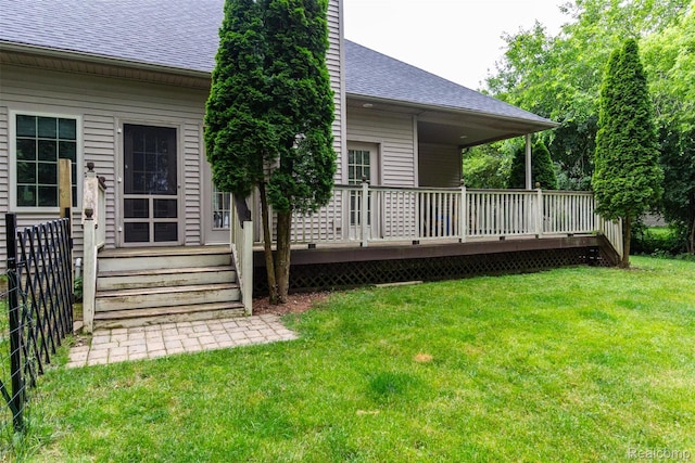 10267 Coachman Ct, Davison, MI 48423 - rear view of house with roof with shingles, a deck, and a lawn