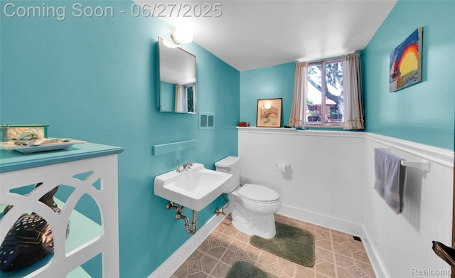 15117 Adams Ave, Warren, MI 48088 - bathroom featuring toilet and a wainscoted wall