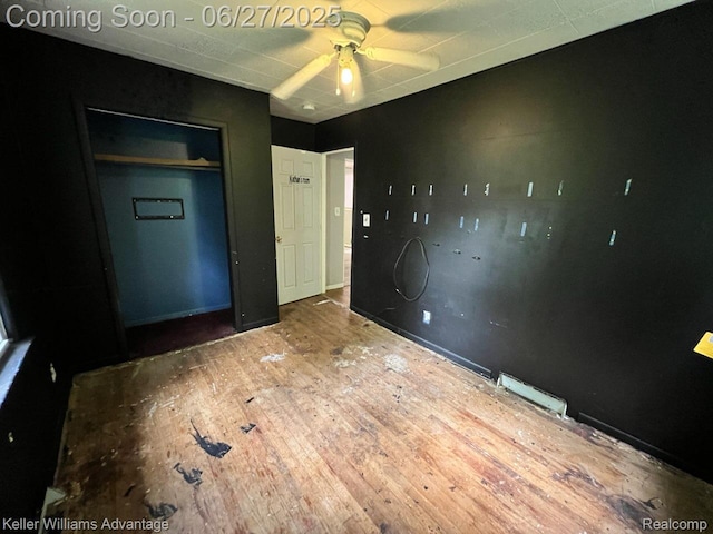 12 Hazel Ave, Pontiac, MI 48341 - unfurnished bedroom with wood finished floors, ceiling fan, and a closet