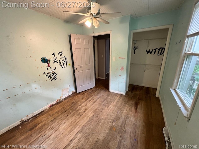 12 Hazel Ave, Pontiac, MI 48341 - unfurnished bedroom featuring hardwood / wood-style floors, a closet, multiple windows, and ceiling fan