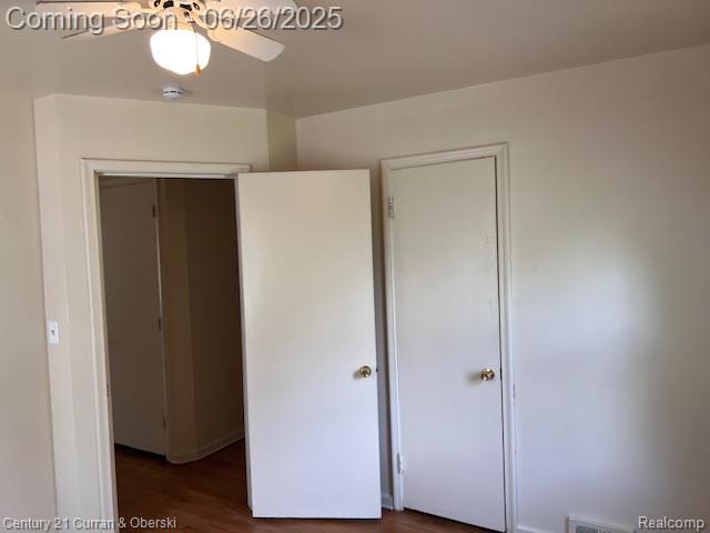 7548 Rockdale, Redford, MI 48239 - unfurnished bedroom with dark wood-style flooring and a closet