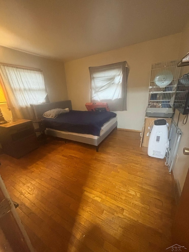 2220 Alice St, Farwell, MI 48622 - bedroom featuring hardwood / wood-style floors