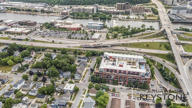 600 Broadway Ave NW Unit 409B, Grand Rapids, MI 49504 - aerial view of property and surrounding area with a highway and a nearby body of water