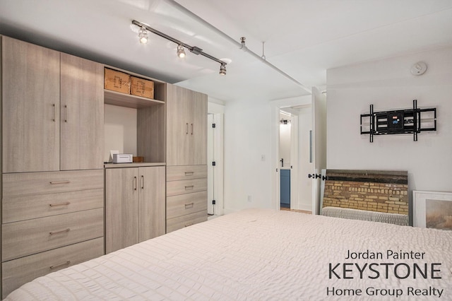 600 Broadway Ave NW Unit 409B, Grand Rapids, MI 49504 - bedroom featuring rail lighting