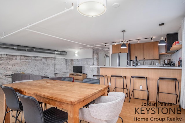 600 Broadway Ave NW Unit 409B, Grand Rapids, MI 49504 - dining area with track lighting and light wood finished floors