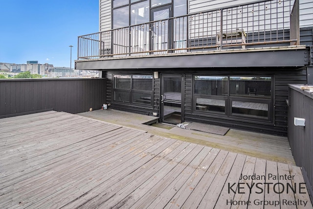 600 Broadway Ave NW Unit 409B, Grand Rapids, MI 49504 - wooden terrace with a city view