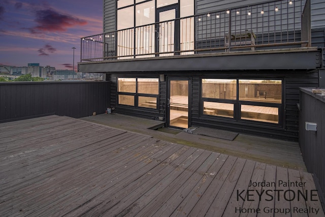 600 Broadway Ave NW Unit 409B, Grand Rapids, MI 49504 - deck at dusk with a city view