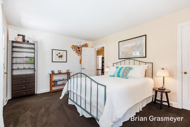 539 Overbrook Ln SE, Grand Rapids, MI 49507 - bedroom featuring dark carpet and baseboards
