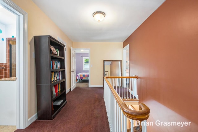 539 Overbrook Ln SE, Grand Rapids, MI 49507 - corridor with an upstairs landing and dark colored carpet