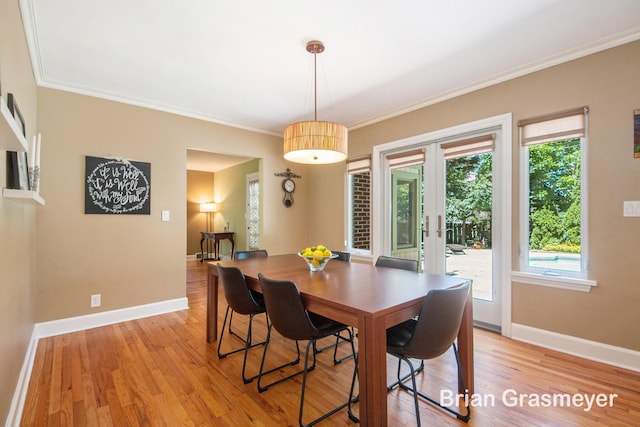 539 Overbrook Ln SE, Grand Rapids, MI 49507 - dining area featuring french doors, ornamental molding, and light wood-style floors