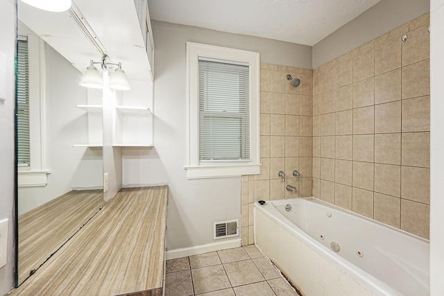 1921 Cornelius Ave SE, Grand Rapids, MI 49507 - full bathroom featuring a combined bath / shower with jetted tub and baseboards