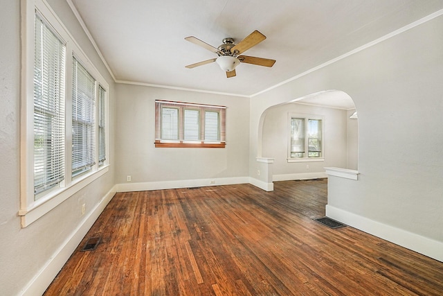1921 Cornelius Ave SE, Grand Rapids, MI 49507 - unfurnished room featuring arched walkways, ceiling fan, wood finished floors, and ornamental molding