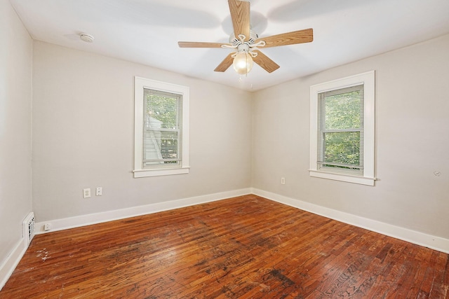 1921 Cornelius Ave SE, Grand Rapids, MI 49507 - spare room featuring wood-type flooring, a smoke detector, and a ceiling fan