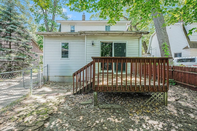 1921 Cornelius Ave SE, Grand Rapids, MI 49507 - rear view of house featuring a fenced backyard and a wooden deck