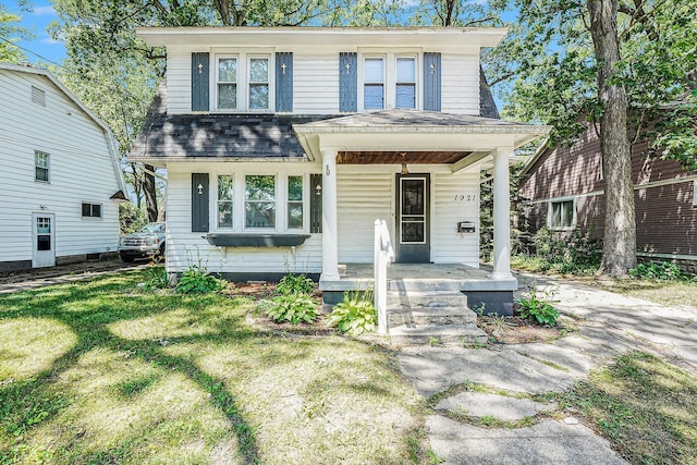 1921 Cornelius Ave SE, Grand Rapids, MI 49507 - view of front facade featuring a porch, roof with shingles, and a front lawn