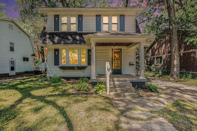 1921 Cornelius Ave SE, Grand Rapids, MI 49507 - view of front of home with covered porch, a front yard, and a shingled roof