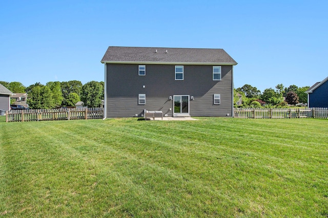 11539 Warrior Trl, Grass Lake, MI 49240 - back of house featuring a patio area and a fenced backyard