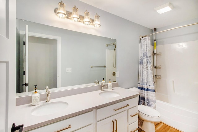 11539 Warrior Trl, Grass Lake, MI 49240 - full bath featuring double vanity, shower / tub combo, and wood finished floors