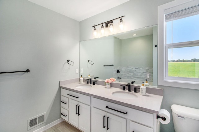 11539 Warrior Trl, Grass Lake, MI 49240 - full bath with double vanity, healthy amount of natural light, and a garden tub