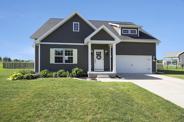 11539 Warrior Trl, Grass Lake, MI 49240 - view of front facade featuring driveway, a shingled roof, and board and batten siding