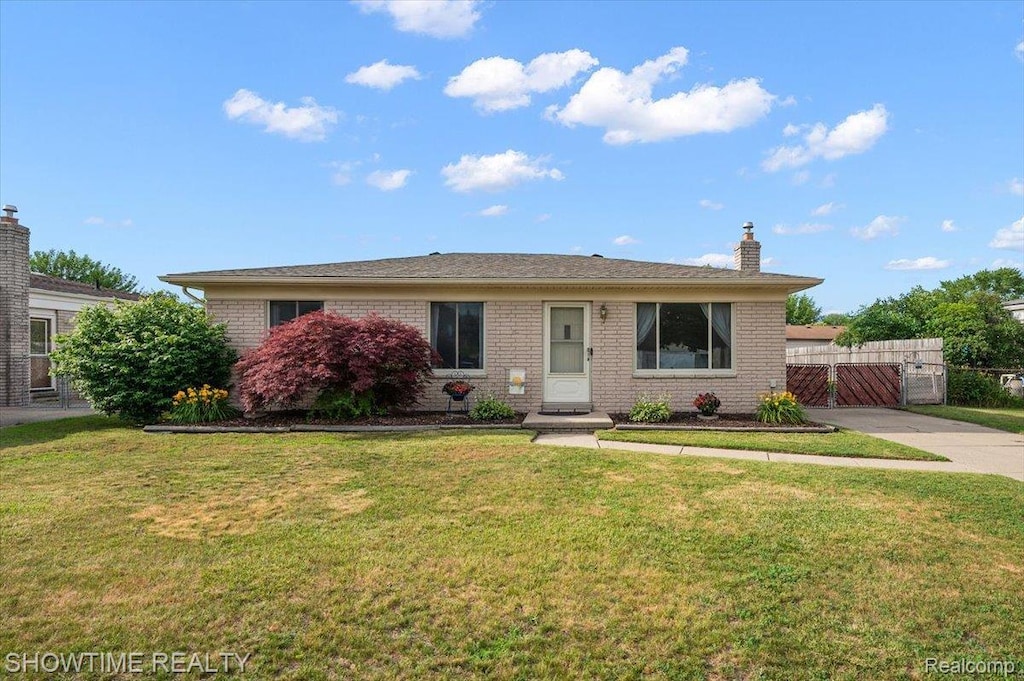 12135 Ontario Dr, Sterling Heights, MI 48313 - view of front of house featuring brick siding and a gate