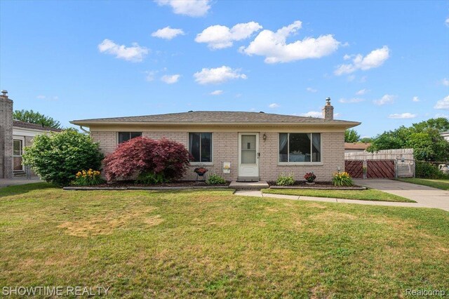 12135 Ontario Dr, Sterling Heights, MI 48313 - view of front of house featuring brick siding and a gate