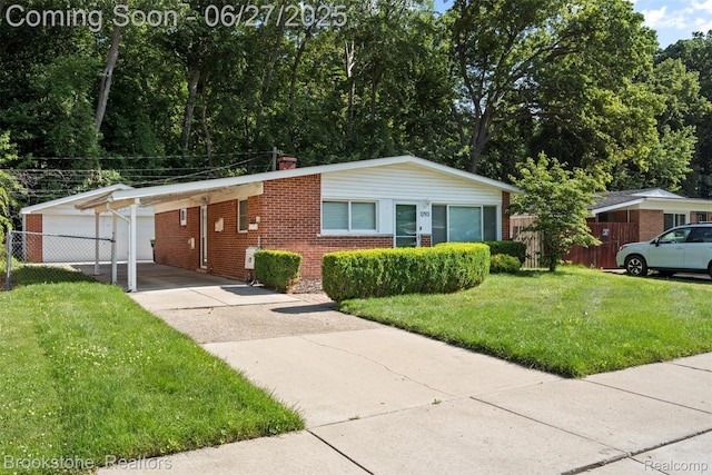 1293 Moulin Ave, Madison Heights, MI 48071 - single story home with brick siding, driveway, a chimney, and an attached carport