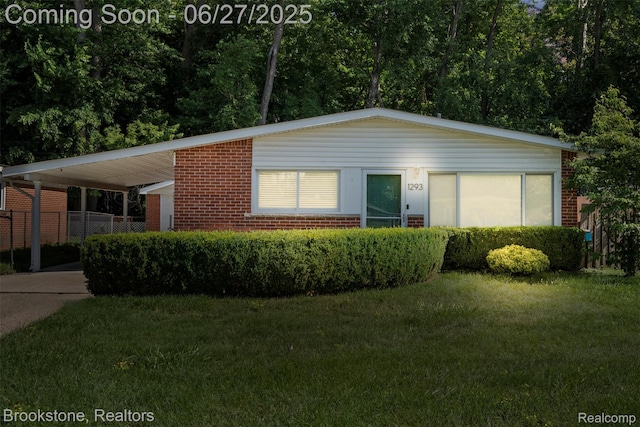 1293 Moulin Ave, Madison Heights, MI 48071 - ranch-style home featuring an attached carport, brick siding, and driveway