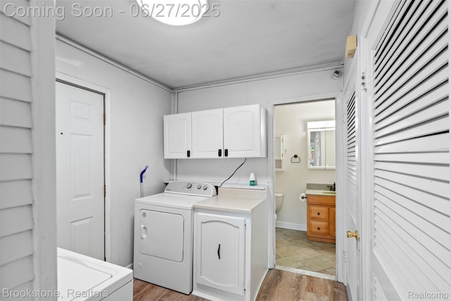 1293 Moulin Ave, Madison Heights, MI 48071 - laundry area featuring cabinet space and light stone finish flooring