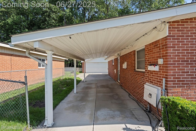 1293 Moulin Ave, Madison Heights, MI 48071 - view of parking / parking lot with a carport, a garage, and concrete driveway