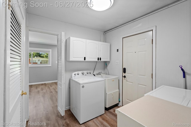1293 Moulin Ave, Madison Heights, MI 48071 - washroom with washer / dryer, cabinet space, and light wood-style floors