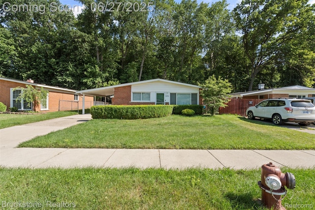 1293 Moulin Ave, Madison Heights, MI 48071 - single story home with driveway, brick siding, and an attached carport