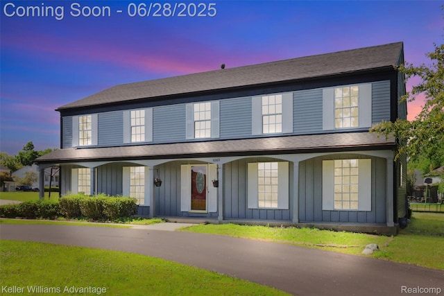 5262 Kingsfield Dr, West Bloomfield, MI 48322 - view of front of property with board and batten siding and a porch