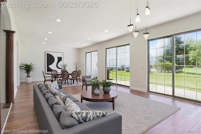 5262 Kingsfield Dr, West Bloomfield, MI 48322 - living area with healthy amount of natural light, recessed lighting, and wood finished floors