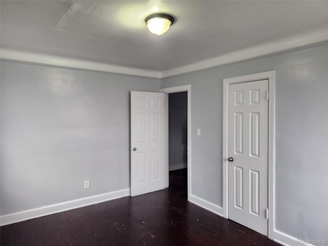 14119 Whitcomb St, Detroit, MI 48227 - unfurnished bedroom featuring baseboards and wood finished floors