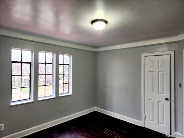 14119 Whitcomb St, Detroit, MI 48227 - empty room featuring dark wood finished floors and baseboards