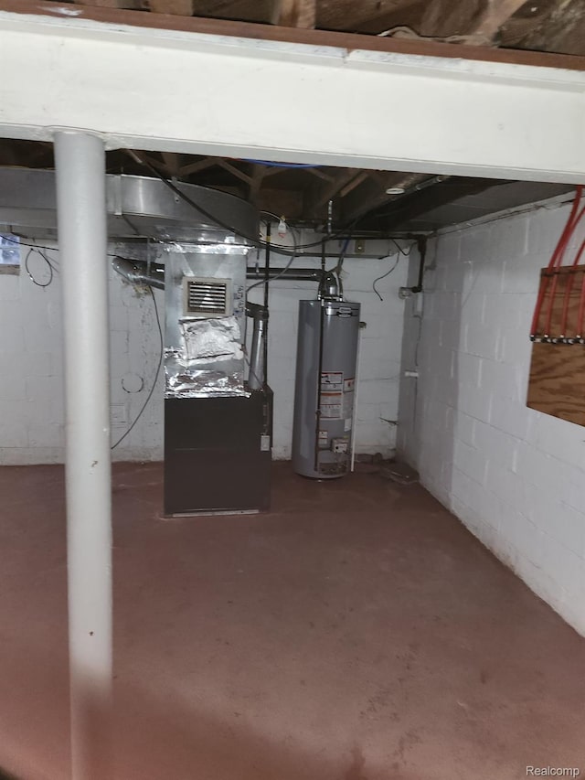 14119 Whitcomb St, Detroit, MI 48227 - unfinished below grade area featuring water heater and heating unit