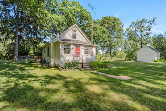 1645 Chlebus St, Jackson, MI 49203 - view of front of home with an outbuilding, a chimney, and a garage
