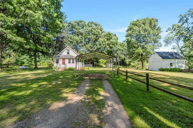 1645 Chlebus St, Jackson, MI 49203 - view of yard featuring driveway, a detached carport, and an outdoor structure