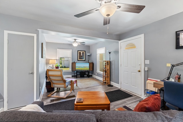 1645 Chlebus St, Jackson, MI 49203 - living room featuring wood finished floors and a ceiling fan