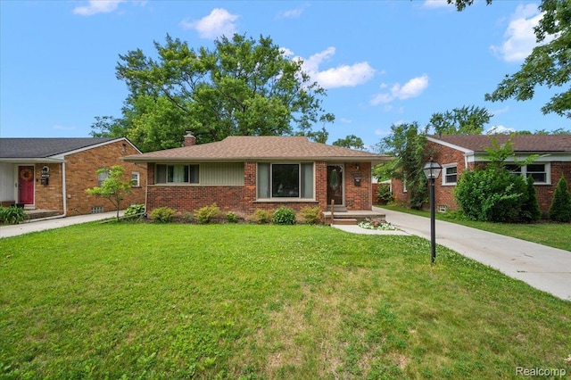 17677 Denby, Redford, MI 48240 - ranch-style home with a chimney, a front yard, brick siding, and driveway