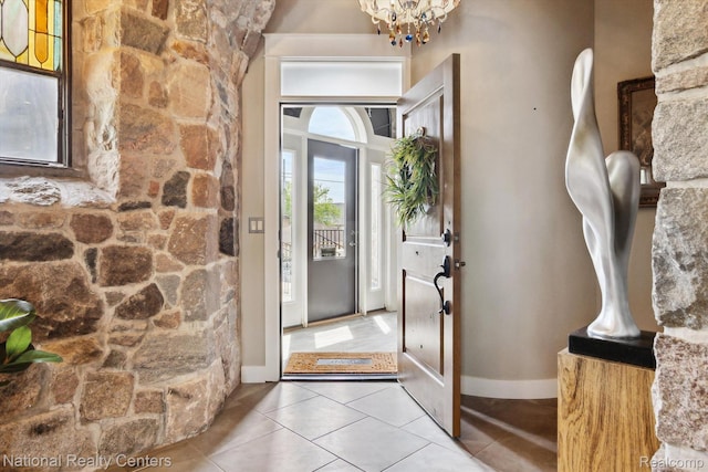 229 E Commerce St Unit 1, Milford, MI 48381 - tiled foyer entrance with a chandelier and baseboards