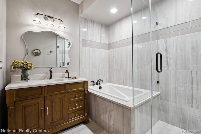 229 E Commerce St Unit 1, Milford, MI 48381 - bathroom with a bath, vanity, and a shower stall
