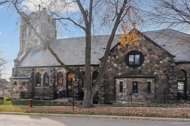 229 E Commerce St Unit 1, Milford, MI 48381 - view of front of house with a high end roof and stone siding
