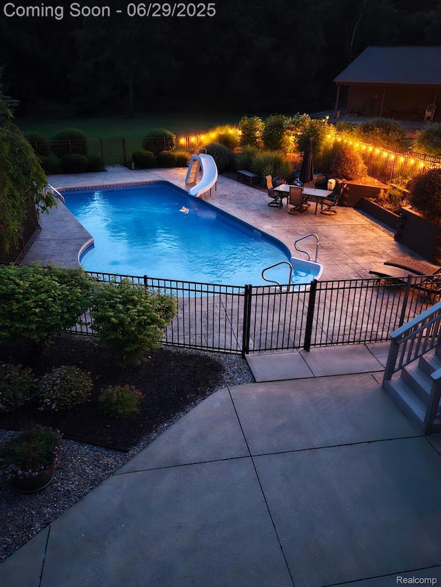 4301 Rolling Acres Dr, Hartland, MI 48353 - view of pool featuring a water slide and a patio
