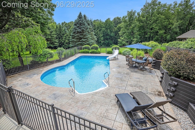 4301 Rolling Acres Dr, Hartland, MI 48353 - view of swimming pool with a water slide and a patio area