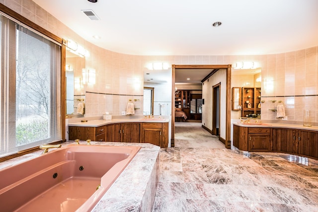 861 S 800 W, Indiana, IN 46341 - bathroom with ensuite bathroom, a tub with jets, vanity, and tile walls