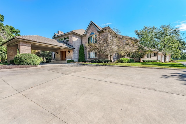 861 S 800 W, Indiana, IN 46341 - view of front of home with concrete driveway, stone siding, and brick siding