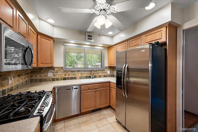 32460 Dunford St, Farmington, MI 48334 - kitchen featuring stainless steel appliances, a ceiling fan, light countertops, light tile patterned floors, and backsplash